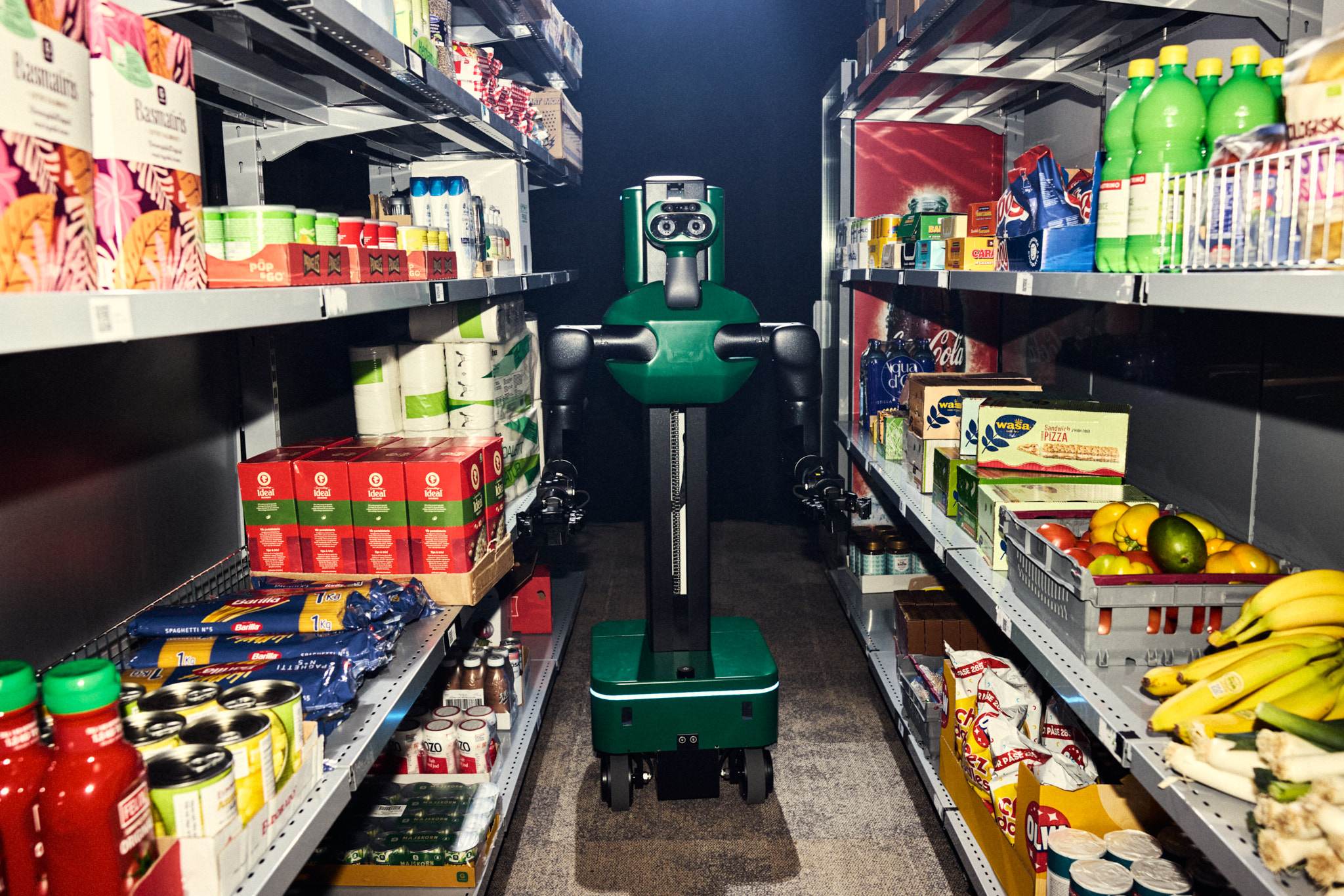 A Cota robot working a store aisle